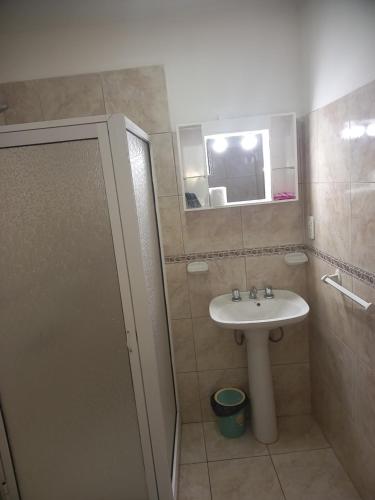 a bathroom with a sink and a mirror at Babella 2 in Concordia