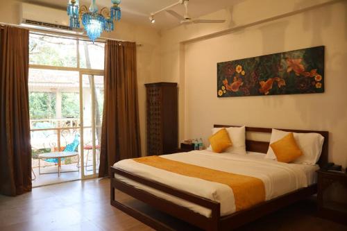 Ένα ή περισσότερα κρεβάτια σε δωμάτιο στο Vibes Inn Singing Tree