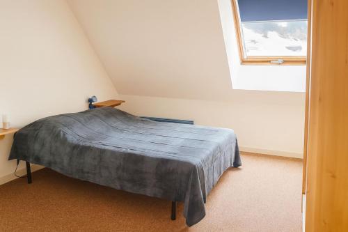 Postel nebo postele na pokoji v ubytování Duplex lumineux et spacieux en plein centre bourg