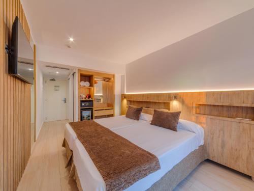 Una cama o camas en una habitación de Hotel Principe Wellness&Spa