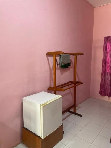 Ένα ή περισσότερα κρεβάτια σε δωμάτιο στο Az Inn