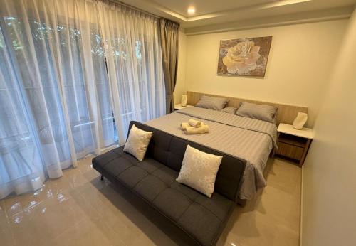 Ένα ή περισσότερα κρεβάτια σε δωμάτιο στο The Terreza Studio Apartment B108 in Lamai