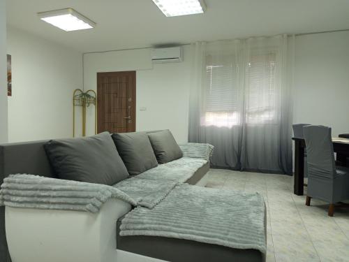 a living room with a couch and a table at Alena'Studio in Gabrovo