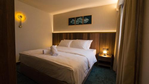 Ένα ή περισσότερα κρεβάτια σε δωμάτιο στο Hotel Central