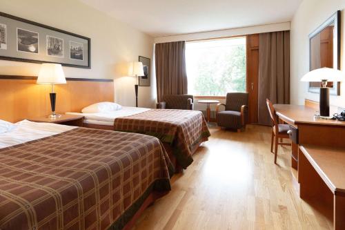 Postel nebo postele na pokoji v ubytování Scandic Aulanko