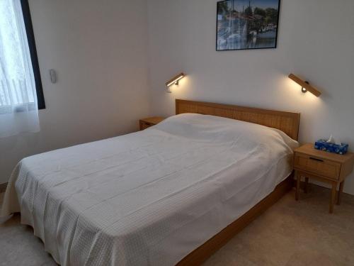 Postel nebo postele na pokoji v ubytování Villa avec SPA 5 places