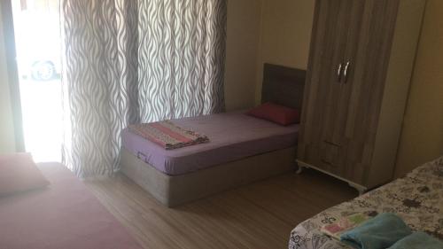 Postel nebo postele na pokoji v ubytování EBAY BEACH OTEl