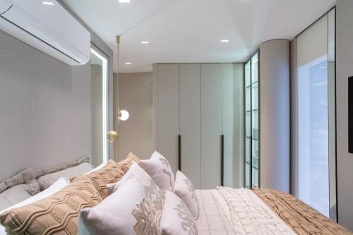 En eller flere senge i et værelse på Experiência de Luxo Totalmente Climatizado e piscina