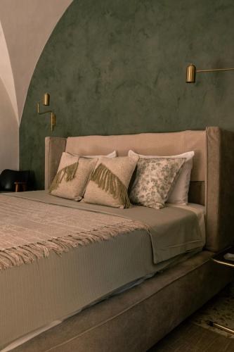 a bedroom with a large bed with pillows on it at Da Leah in Ragusa