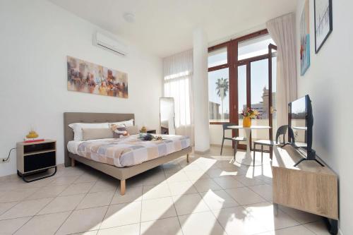 Ένα ή περισσότερα κρεβάτια σε δωμάτιο στο Fiumicino View - Casa Centrale e Tranquilla