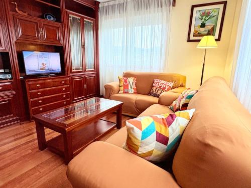 Et tv og/eller underholdning på Casa CAMPELO- APTO Playa de Rodeira CANGAS - Garaje y WiFi gratis