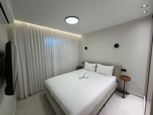 Postel nebo postele na pokoji v ubytování מילה דירות אירוח - Mila