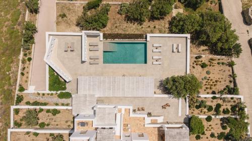 an aerial view of a house with a swimming pool at Bohemian Blue Villa - 7 BDRM - beach in 200m - MG Villas in Mykonos