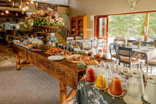 a long table with food on top of it at Casterbridge Hollow Boutique Hotel in White River