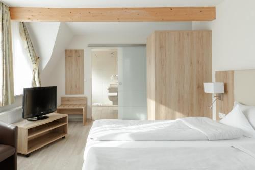 Ένα ή περισσότερα κρεβάτια σε δωμάτιο στο WohnGut Koblenz