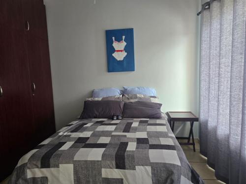 Postel nebo postele na pokoji v ubytování Topanga 31