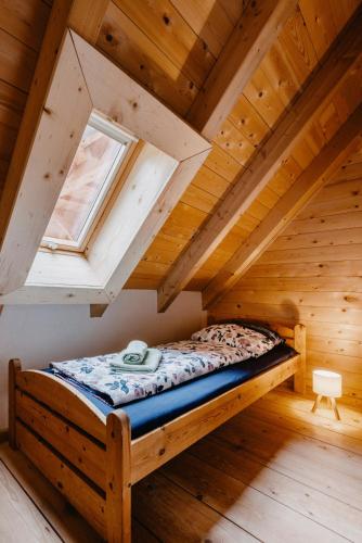 a bed in the attic of a log cabin at Tannherz in Kleines Wiesental