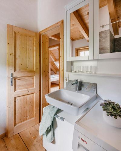 a bathroom with a sink and a mirror at Tannherz in Kleines Wiesental