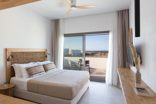 A bed or beds in a room at Sundunes Hotel Naxos
