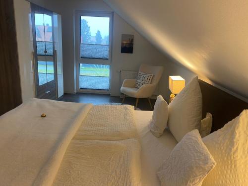 Ένα ή περισσότερα κρεβάτια σε δωμάτιο στο TiWu - Ferienwohnungen