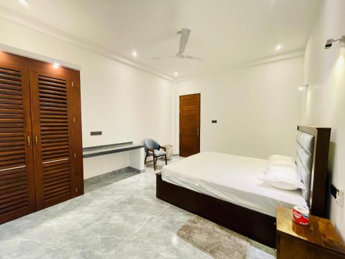 Un ou plusieurs lits dans un hébergement de l'établissement Harmon Weligama