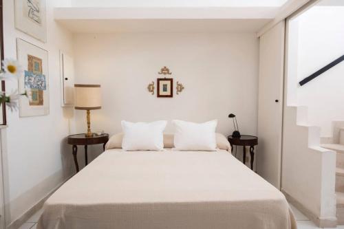 Ένα ή περισσότερα κρεβάτια σε δωμάτιο στο La Dimora del Re