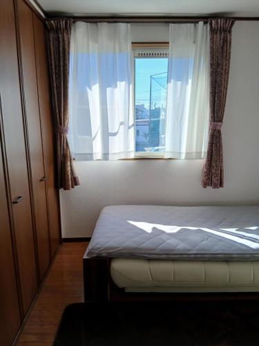 Ένα ή περισσότερα κρεβάτια σε δωμάτιο στο れのん