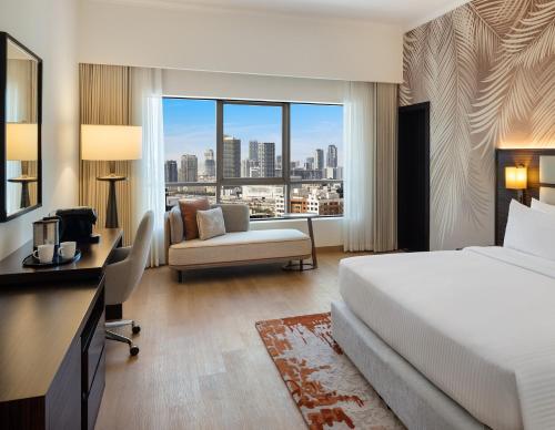 Postel nebo postele na pokoji v ubytování Vintage Grand Hotel Dubai