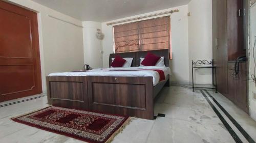 Postel nebo postele na pokoji v ubytování Collection O Upasana Park Newtown Formerly Hotel Nirwana