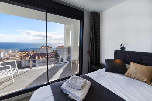 En eller flere senge i et værelse på Blue Suites 204