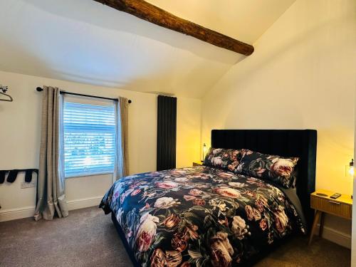 Voodi või voodid majutusasutuse Jasmine Cottage Audlem toas