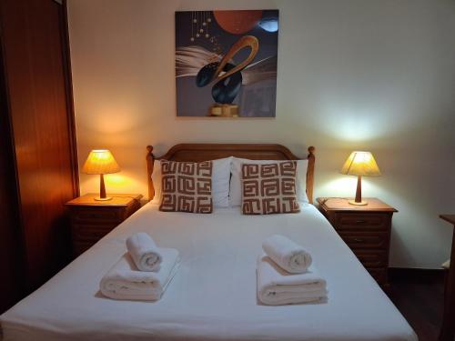 a bedroom with a bed with towels on it at Ribeira Brava Studios - L in Ribeira Brava