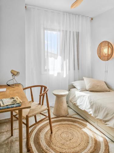 a bedroom with a bed and a table and a chair at 3 BDR Detached house in Chayofa in Chayofa