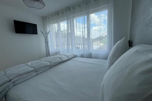 Postel nebo postele na pokoji v ubytování Résidence Beausoleil appartement 2