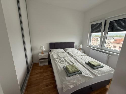 Ένα ή περισσότερα κρεβάτια σε δωμάτιο στο Mountain View Lux Apartment