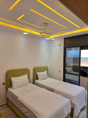 Ένα ή περισσότερα κρεβάτια σε δωμάτιο στο Dar aya comfort