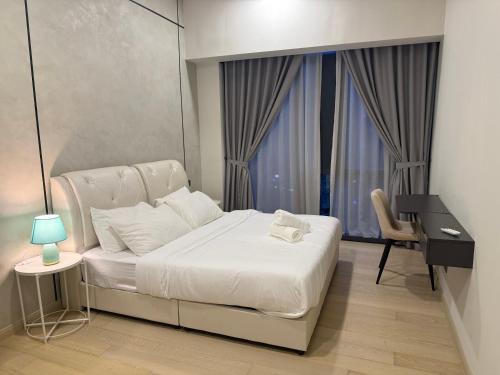 Ένα ή περισσότερα κρεβάτια σε δωμάτιο στο Star Residance KLCC