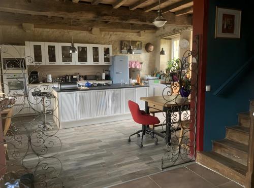 Kuchyň nebo kuchyňský kout v ubytování Chambres d'hôtes Exotique