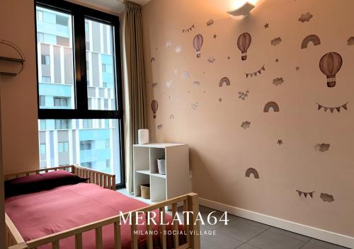 Ένα ή περισσότερα κρεβάτια σε δωμάτιο στο Merlata64