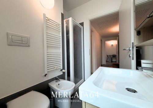 Ένα ή περισσότερα κρεβάτια σε δωμάτιο στο Merlata64