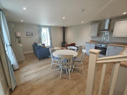 a kitchen and living room with a table and chairs at 2 Bed in Castleton oc-p34012 in Castleton