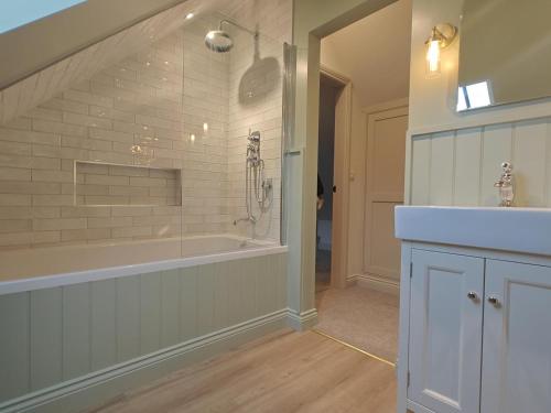 a bathroom with a large tub and a sink at 2 Bed in Castleton oc-f34013 in Castleton