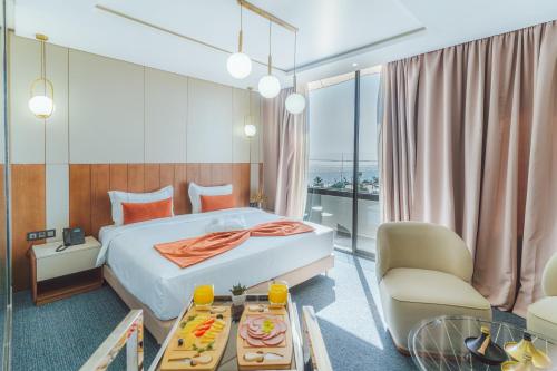 Ένα ή περισσότερα κρεβάτια σε δωμάτιο στο TheMirell Hôtel Dakhla