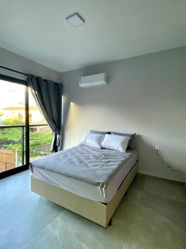 Postel nebo postele na pokoji v ubytování Riviera de Garopaba Unidade Vista Mar