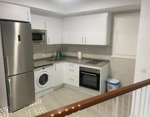 Kuchyň nebo kuchyňský kout v ubytování apartamento isabel