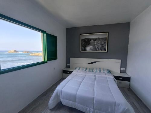 Ένα ή περισσότερα κρεβάτια σε δωμάτιο στο Taganana Sunset Sea View