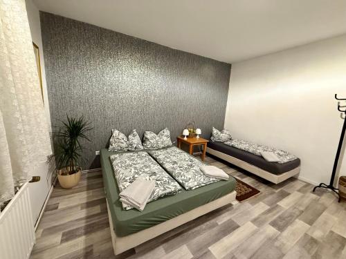 Postel nebo postele na pokoji v ubytování Pott Rooms & Flats