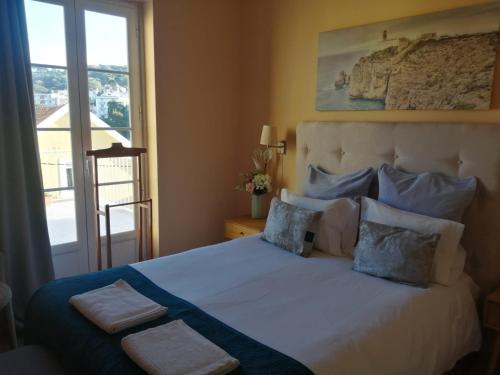 Ένα ή περισσότερα κρεβάτια σε δωμάτιο στο CasAzulApartments