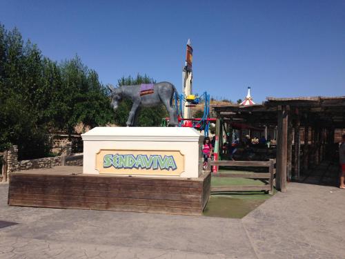 a statue of a horse standing on top of a box at Apartamento Turistico Cigüeña de Arguedas in Arguedas