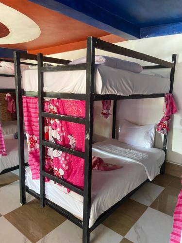 a group of bunk beds in a room at Mekong Backpackers 2 PB in Pakbeng
